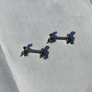 Dinosaur nipple rings
